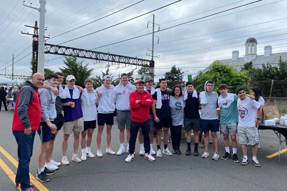 walkers in a group at the Walk A Mile in her shoes event