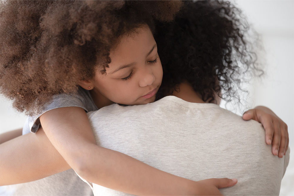 child hugging parent